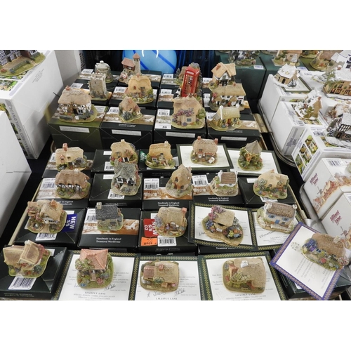 80 - Thirty-two Lilliput Lane cottage and other ornaments including 'Good Luck' and 'It's for You' (boxed... 