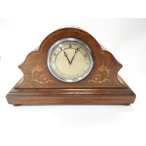 184 - Edwardian mahogany and inlaid mantel clock sitting on brass pad feet