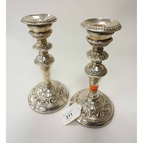 211 - Pair of silver scrolled candlesticks, Birmingham 1966 (loaded), height 19.5cm