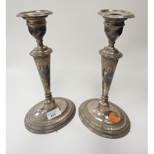 217 - Pair of silver plated tapered column candlesticks, height 30cm