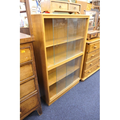 493 - Light oak glazed four door bookcase, width 76cm, height 121cm