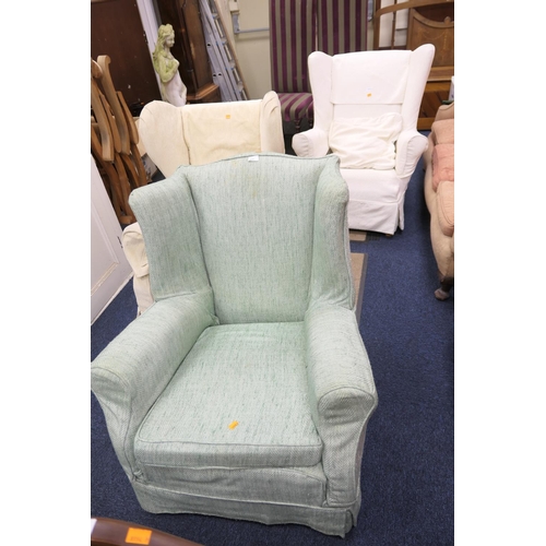 571 - Three wing armchairs in loose covers