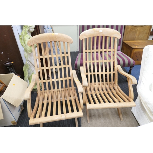 572 - Pair of teak folding steamer chairs