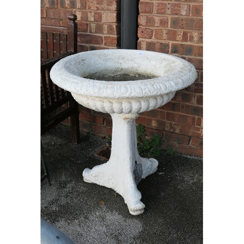 578 - White painted reconstituted stone shallow pedestal urn on dolphin supports, 73cm diameter, height 75... 