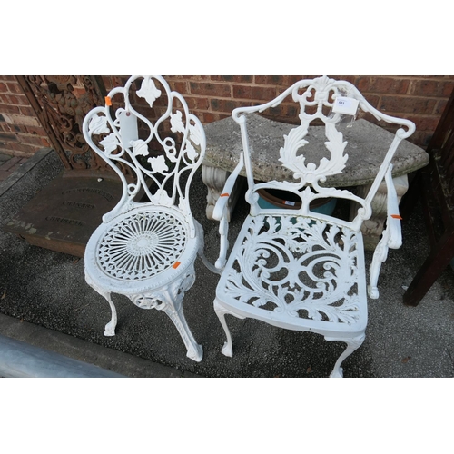 581 - Two white painted cast alloy garden chairs