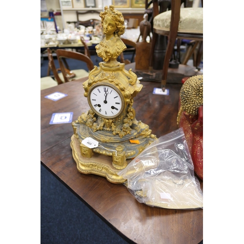 605 - French ormolu mantel clock on a gilded wooden base