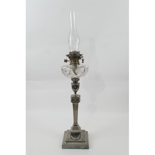 121 - Edwardian silver plated pedestal oil lamp, by Walker & Hall,having a cut glass tank over an Adam sty... 