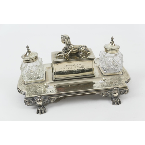 125 - Late Victorian silver plated presentation inkstand, circa 1895, shaped rectangular stand supporting ... 