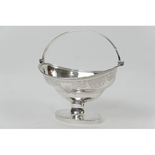 130 - George III silver sugar basket, by Solomon Houghton, London 1797, oval form with swing handle, engra... 