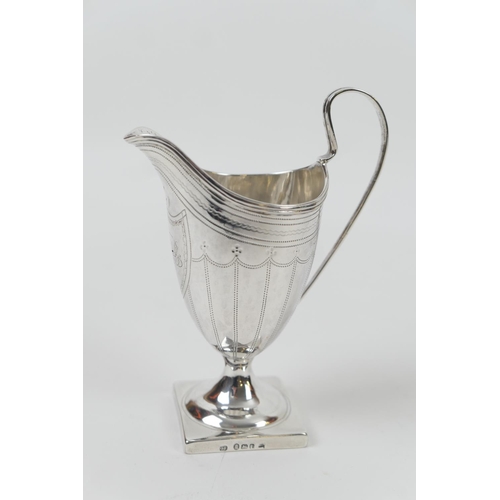 132 - George III silver cream jug, maker's mark indistinct, London 1794, helmet shape with a monogrammed s... 