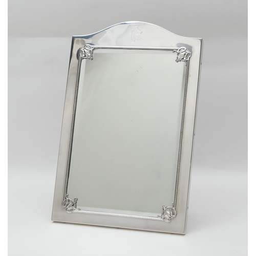 135 - Edwardian silver dressing table mirror, bevelled glass plate within a plain polished frame with corn... 