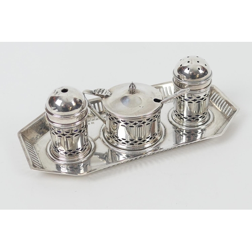 150 - George V silver three piece condiment on stand, Birmingham 1927, comprising pepper pot, salt pot and... 