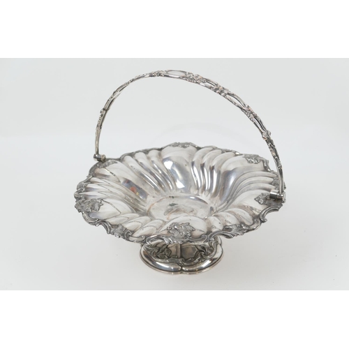 163 - Victorian  silver plated table basket, fluted circular form with swing handle, raised on a trumpet b... 