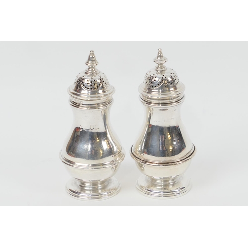 176 - Matched pair of silver pepper pots, one Charles Stuart Harris, London 1897, the other Birmingham 192... 