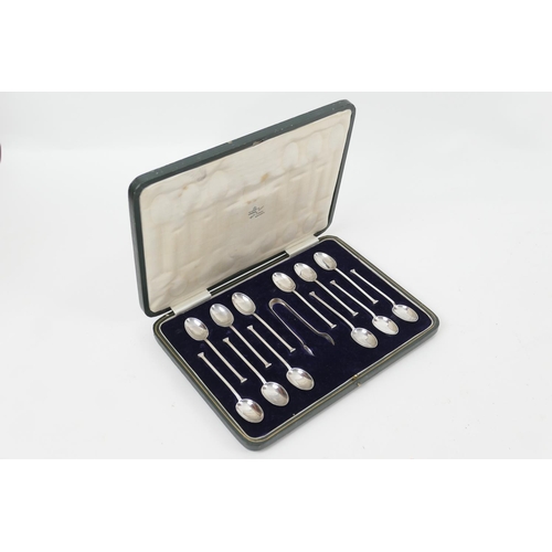 183 - Set of twelve George V silver hobnail teaspoons, Sheffield 1921, and sugar tongs, gross weight appro... 