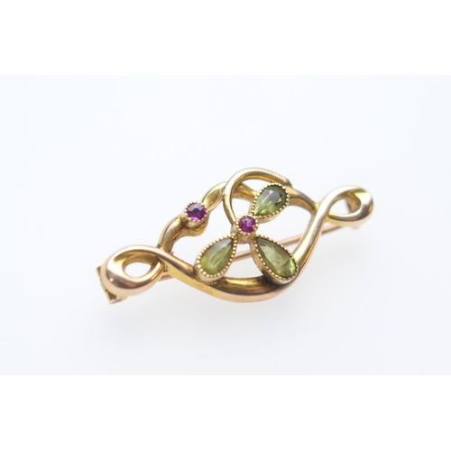 232 - 9ct gold peridot and ruby clover leaf bar brooch, by HG&SL Ltd, beaded collet mounted tear shaped pe... 