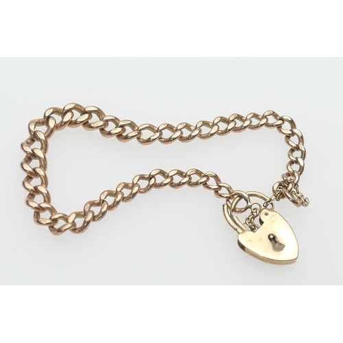 233 - 9ct gold graduated curb link bracelet, with padlock clasp united by a safety chain, weight approx. 1... 