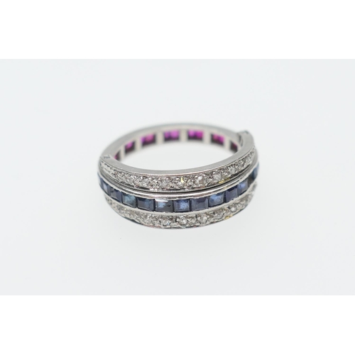 257 - Ruby, sapphire and diamond multi-way ring, having a central band, half set with channel set square c... 