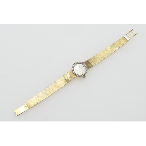 261 - Omega lady's 18ct gold and diamond cocktail watch, the circular champagne coloured dial with baton n... 