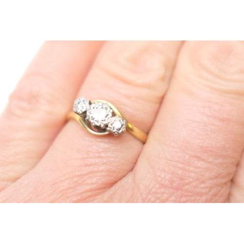 263 - Diamond three stone ring, round brilliant cut diamonds illusion set in platinum in a crossover mount... 