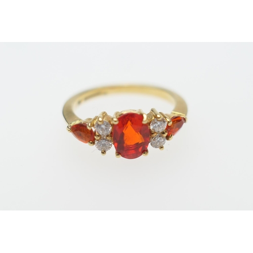 288 - CATALOGUE AMENDMENT: Diamond and FIRE OPAL cluster ring, 18ct gold set with an oval cut central Ston... 