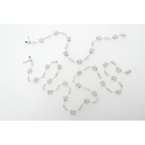 293 - Diamond necklace and matching bracelet, in 18ct white gold, the necklace having flowerheads set with... 