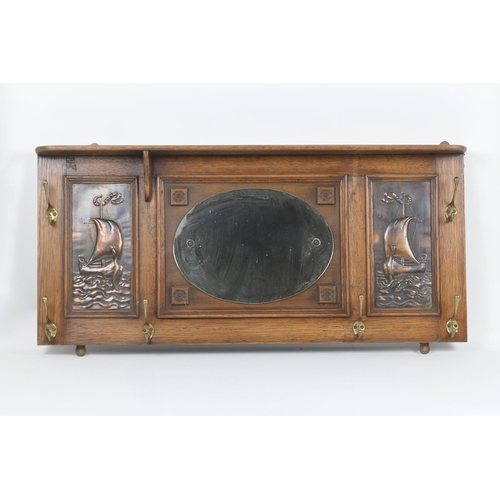 641 - Arts and Crafts period mirrored oak wall mounted hall stand, fitted with an upper shelf over an oval... 