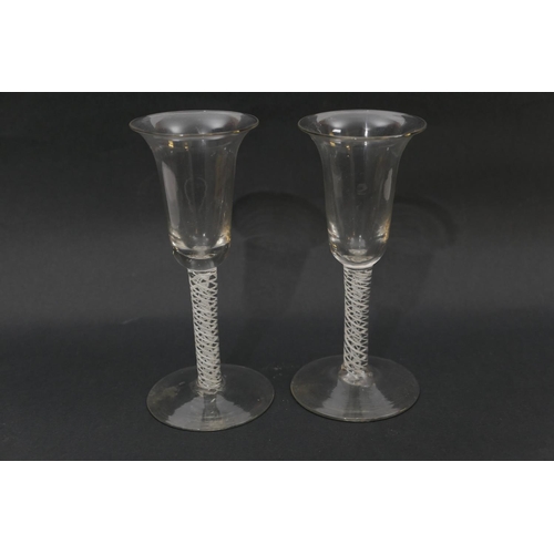 68 - Pair of opaque twist wine glasses, bell shaped bowl over a double helix twist stem and conical foot,... 