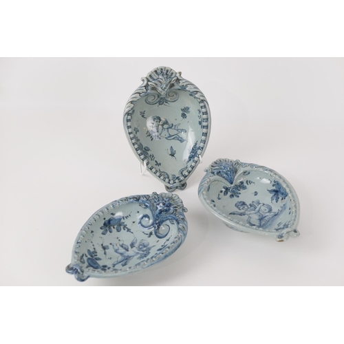 79 - Three Cantigalli heart shaped dishes, each decorated in the 18th Century style with cherubs, in blue... 