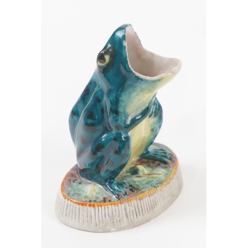 88 - Unusual frog form match holder and striker, glazed colours on a bisque base, height 8cm