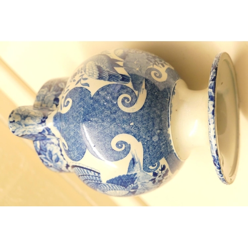 56 - Unusual blue and white transfer printed surprise jug, circa 1820, printed with bush turkeys, bordere... 