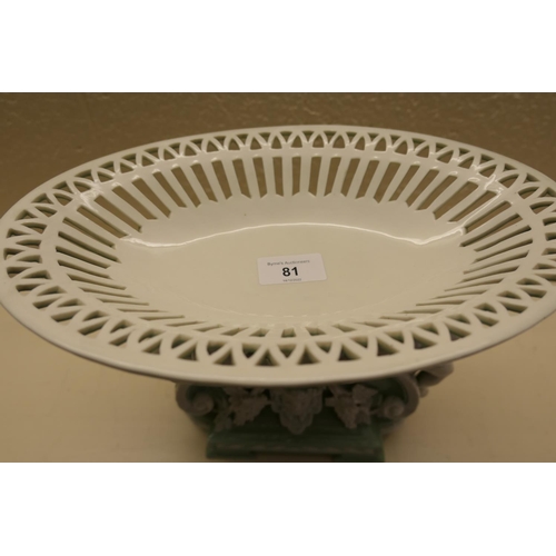 81 - Minton glazed parian table centrepiece, circa 1874, with an oval basket supported by reclining cheru... 