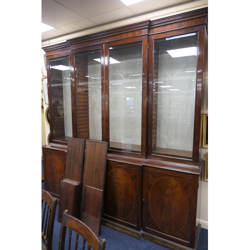 627 - Late 19th Century mahogany and inlaid breakfront library bookcase, in Georgian style, having a mould... 