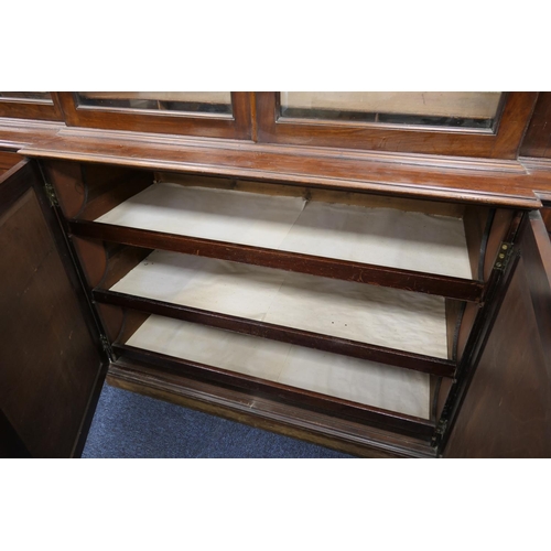 627 - Late 19th Century mahogany and inlaid breakfront library bookcase, in Georgian style, having a mould... 