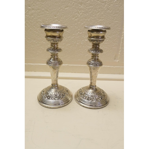 184 - Pair of silver scrolled candlesticks, Birmingham 1966 (loaded), height 19.5cm