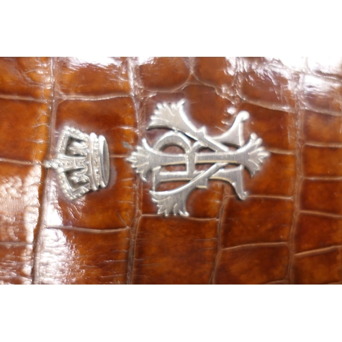 140 - Queen Victoria interest: a late Victorian silver mounted crocodile skin note wallet by Drew & Sons, ... 