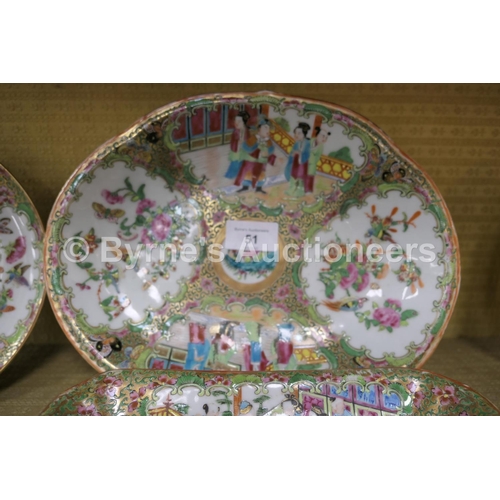 51 - Chinese Canton famille rose dessert service, early 19th Century, typically decorated with panels of ... 