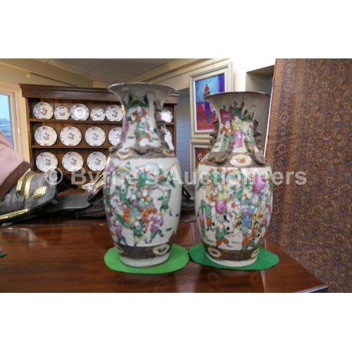 59 - Two Chinese crackle glazed famille rose vases, late 19th Century, each similarly decorated with warr... 