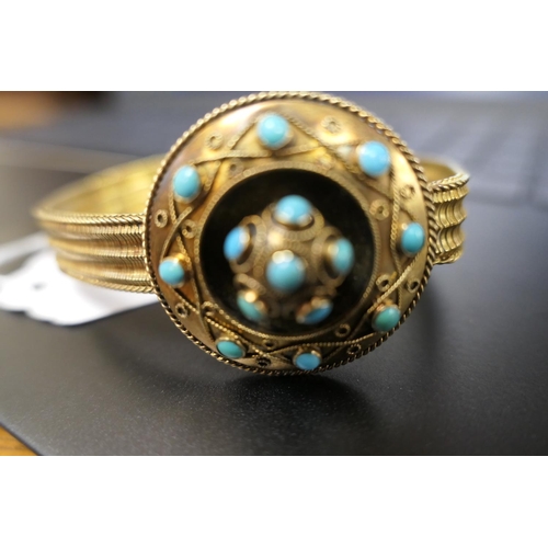 272 - Victorian turquoise and gilt coloured bracelet, the target form boss with cannetille decoration and ... 