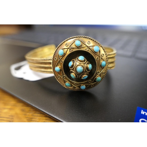 272 - Victorian turquoise and gilt coloured bracelet, the target form boss with cannetille decoration and ... 