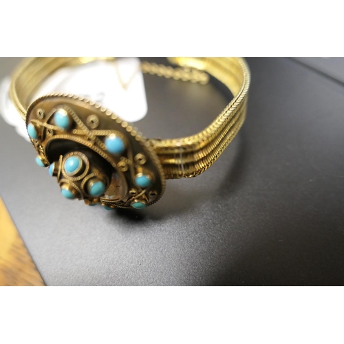 272 - Victorian turquoise and gilt coloured bracelet, the target form boss with cannetille decoration and ... 