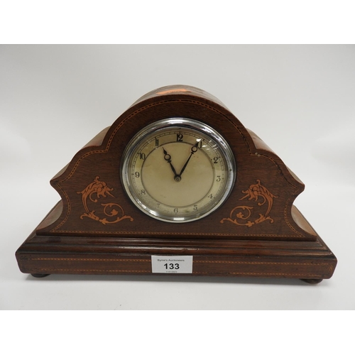 133 - Edwardian mahogany and inlaid mantel clock sitting on brass pad feet