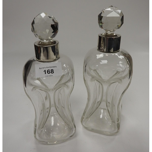 168 - Pair of silver mounted clear glass kluk-kluk decanters, the collars hallmarked Birmingham 1912, with... 