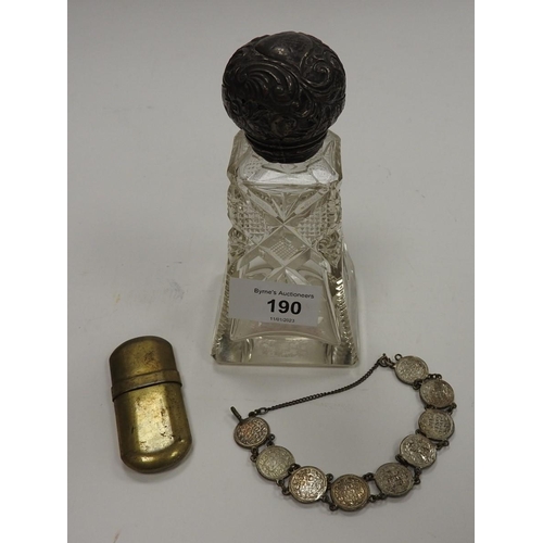 190 - Silver mounted cut glass scent bottle (af); also a silver coin bracelet and a brass lighter (3)