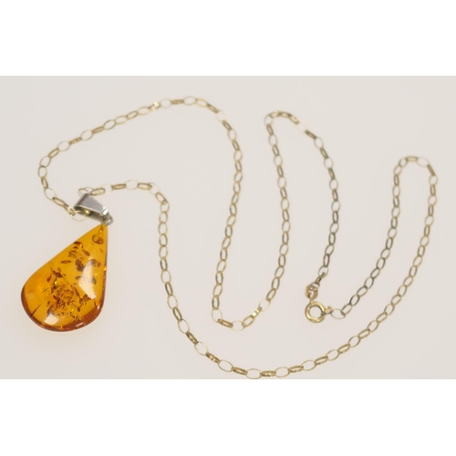 223 - 9ct gold belcher chain necklace supporting a Baltic amber pendant, gold weight 3.8g