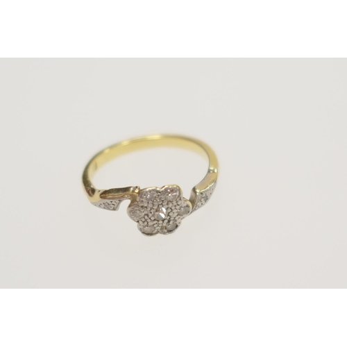 232 - Diamond flower head cluster ring in a crossover setting in 18ct gold, ring size 'L', gross weight 2.... 