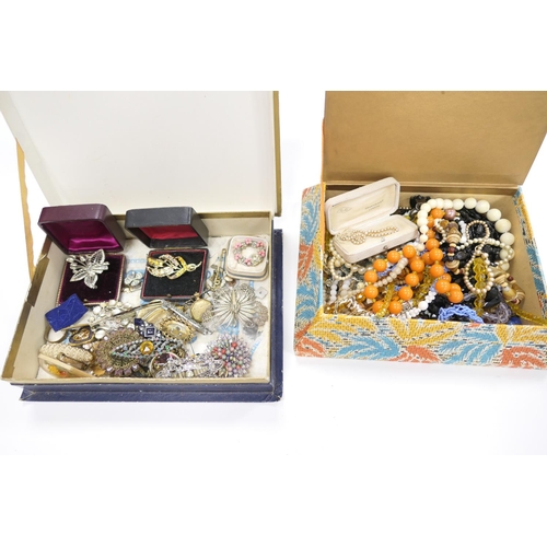 324 - Two card boxes of assorted costume jewellery