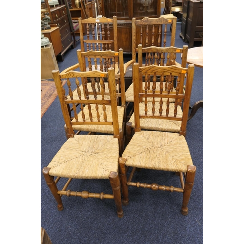 473 - Six ash spindle back dining chairs comprising two carvers, four singles, each with rush seats