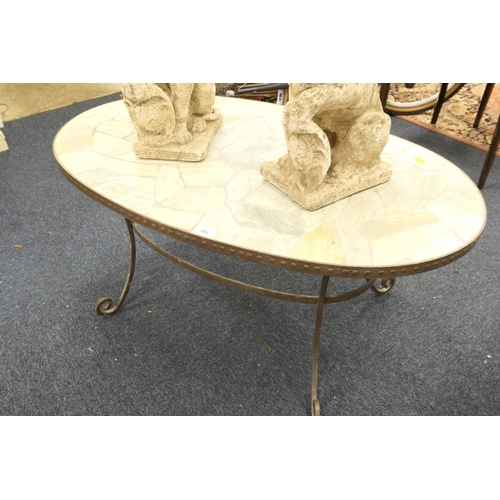 503 - Wrought metal framed oval coffee table with crazy paved stone stop