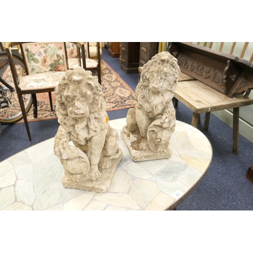 504 - Pair of reconstituted stone heraldic lions, height 41cm